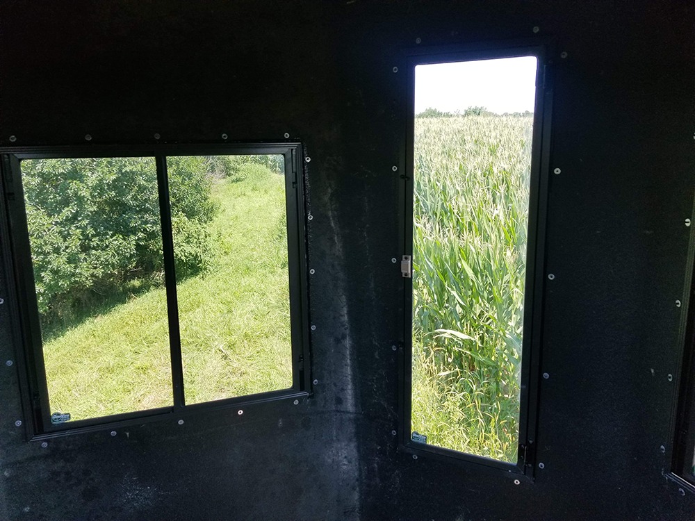Hunting blind with 24 x 24 slide window and vertical bow window