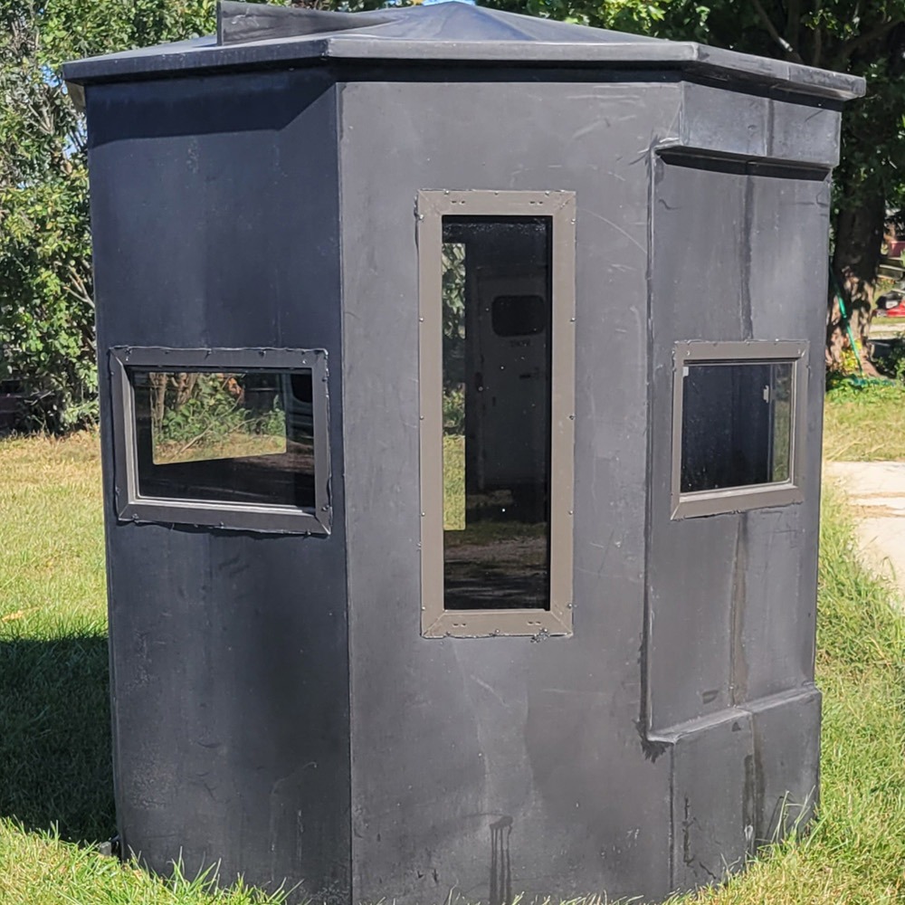 Eight-sided hunting blind on grass